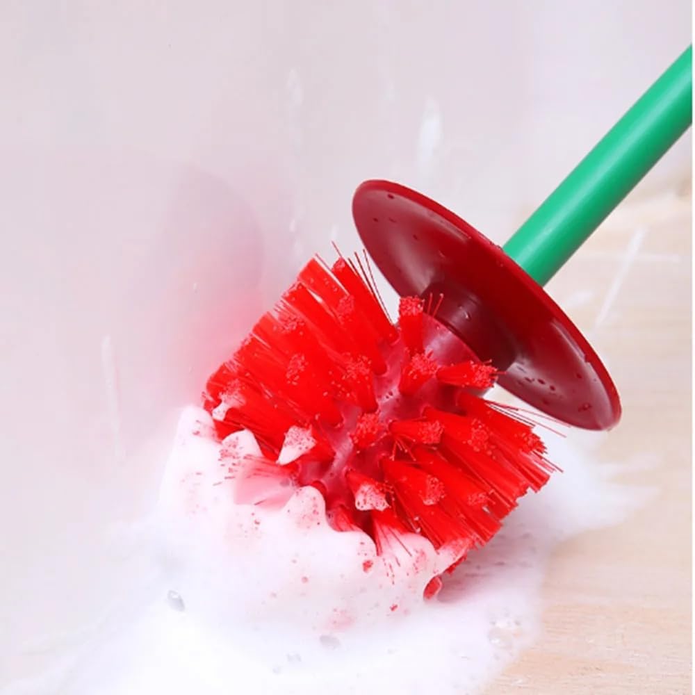 Cleaning brush with red bristles and green handle in a soapy water