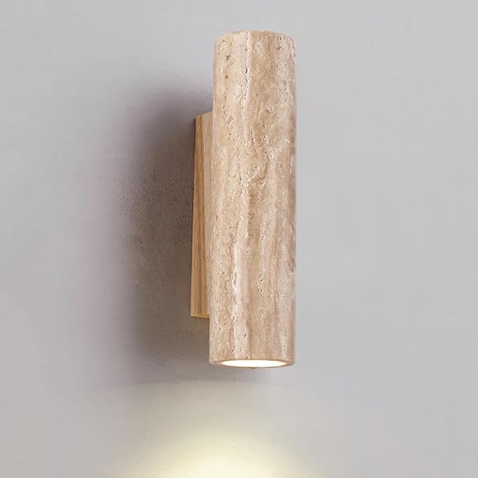 Beige cylindrical wall light fixture on a gray background