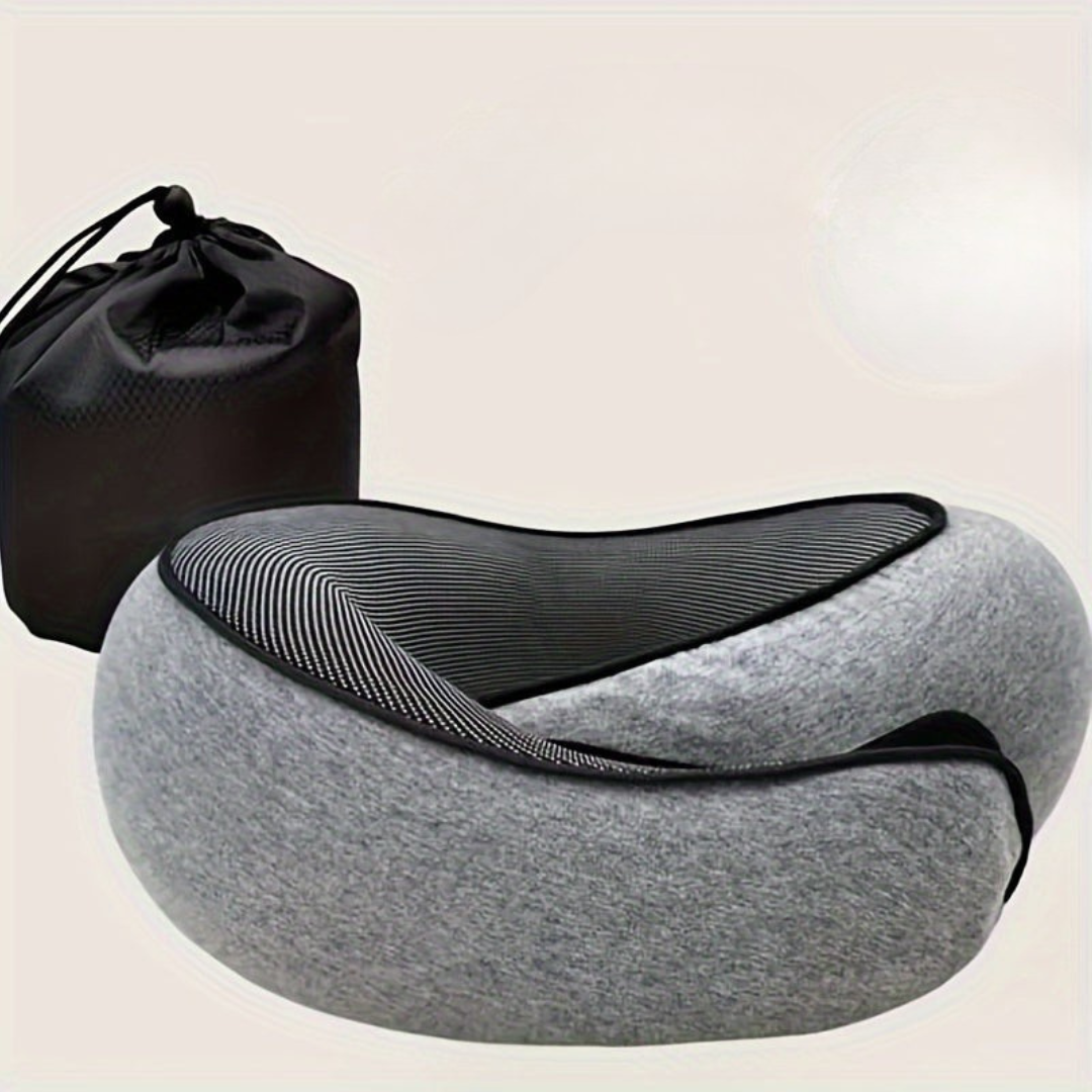 Gray travel neck pillow with black mesh and drawstring bag on a beige background