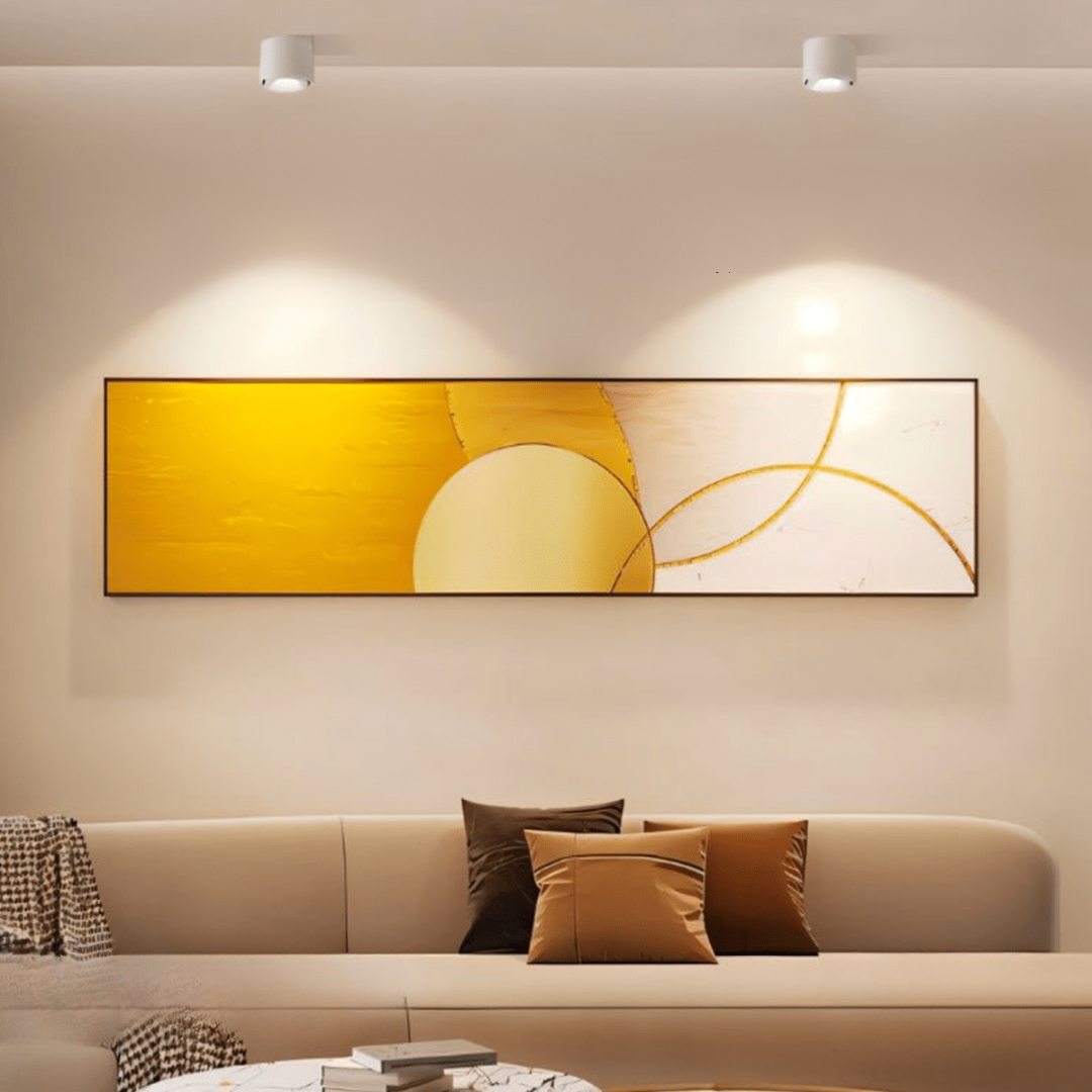 Modern living room with a large abstract painting on the wall above a beige sofa.