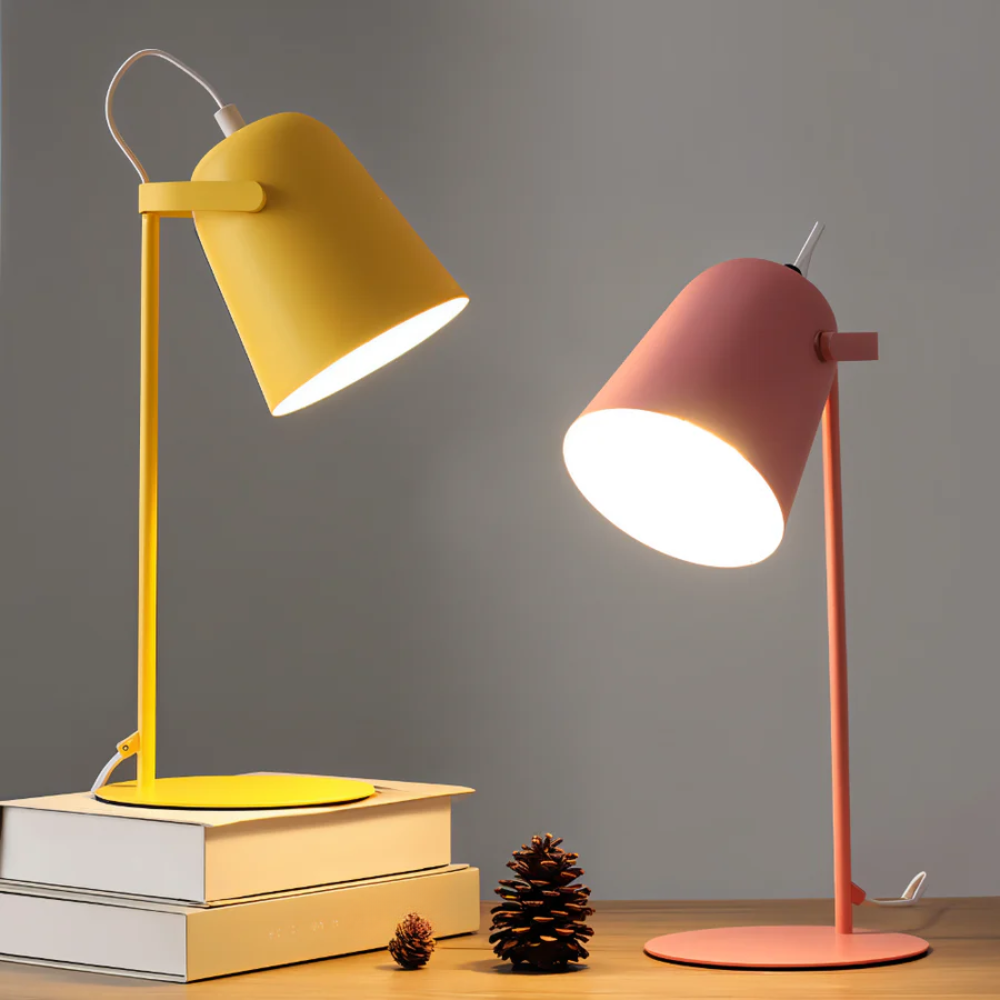 Yellow and pink desk lamps on a gray background