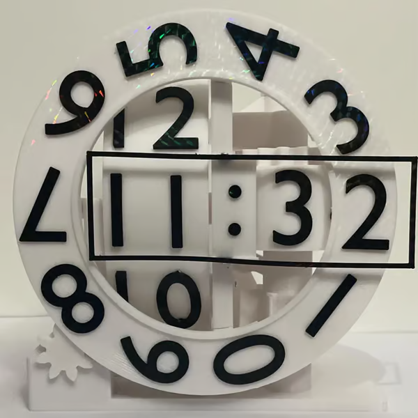 Black and white clock with numbers and time displayed