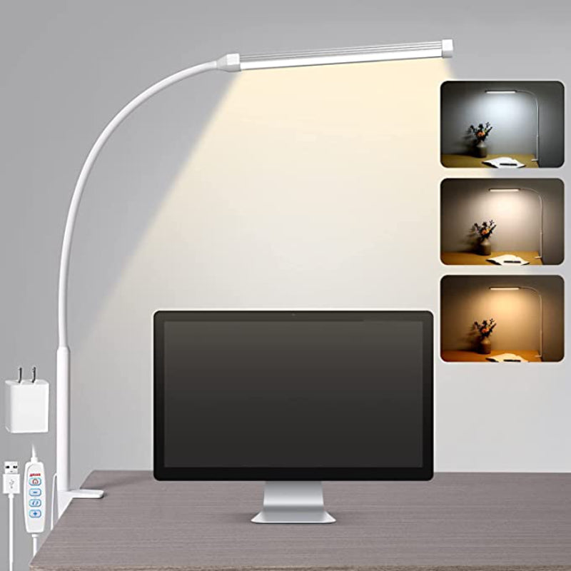 White adjustable desk lamp illuminating a computer monitor on a desk with multiple light settings shown.