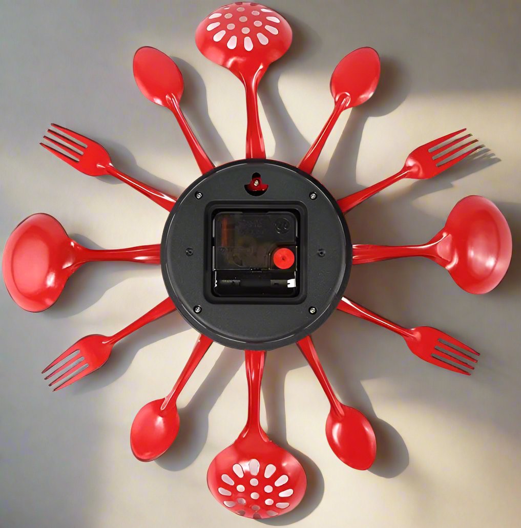Red spoon and fork wall clock on a gray background