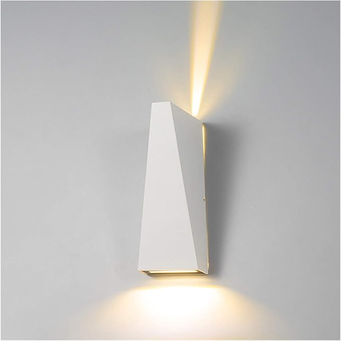 Modern wall-mounted light fixture on a gray wall