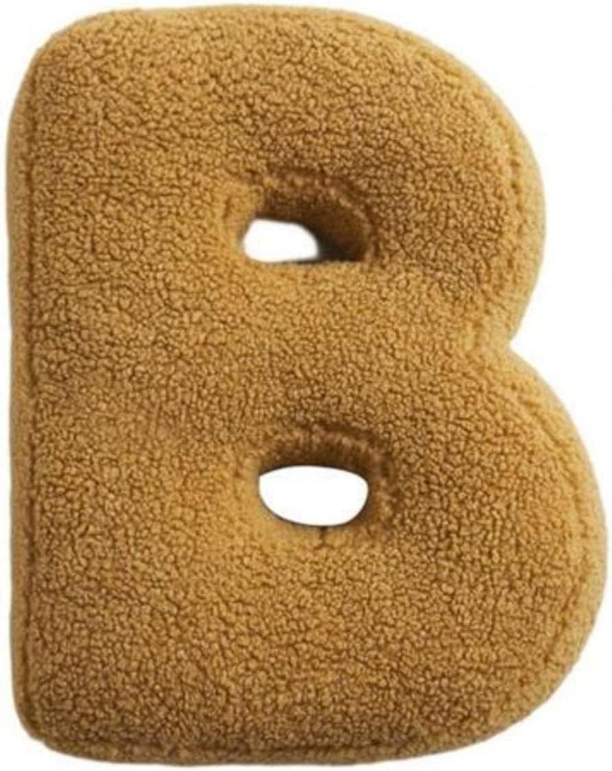 Fuzzy letter 'B' pillow on a white background