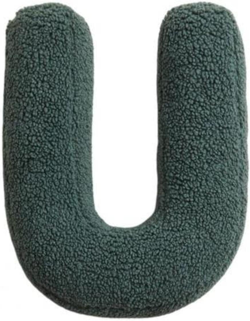 Green U-shaped pillow on a white background