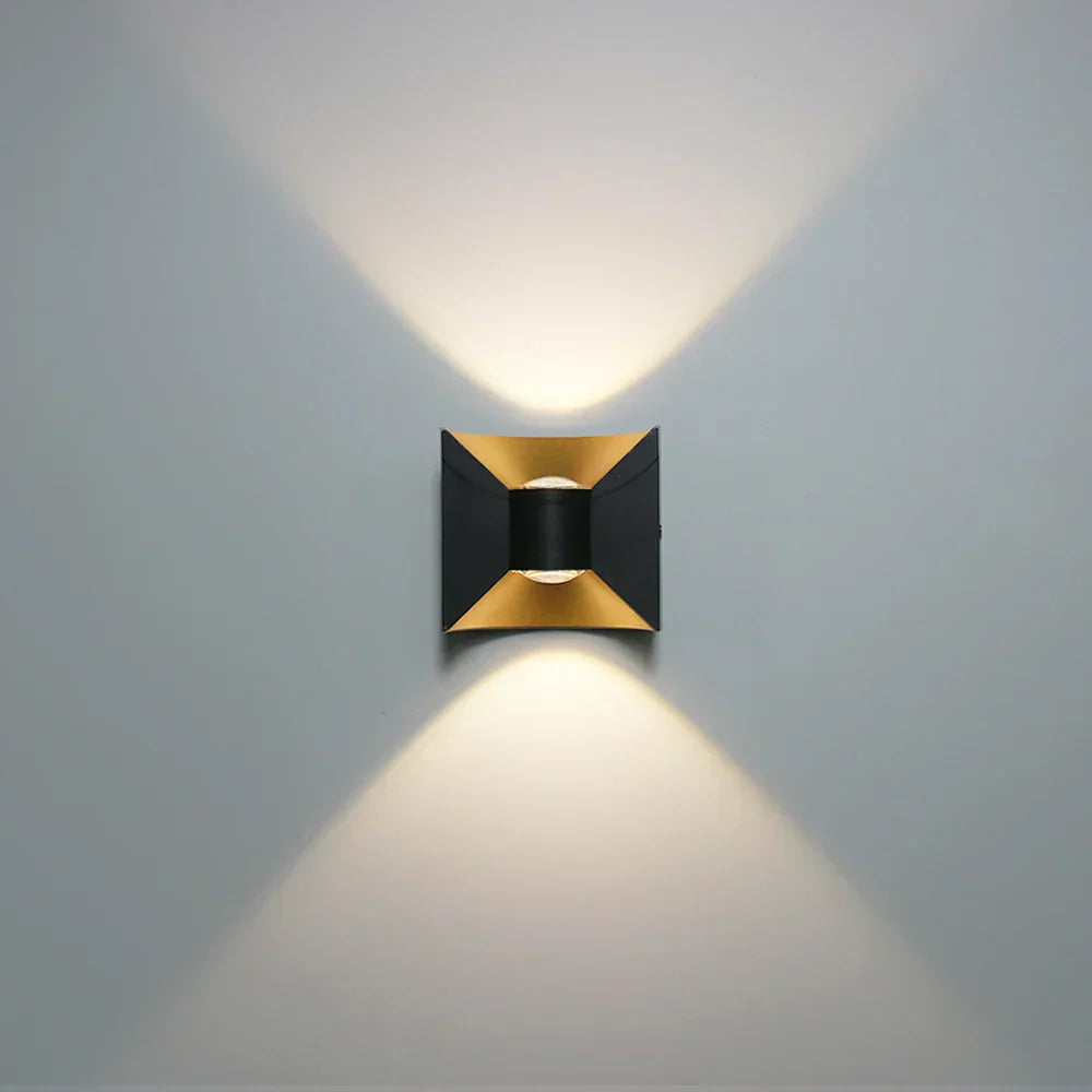 Modern wall-mounted light fixture on a gray wall