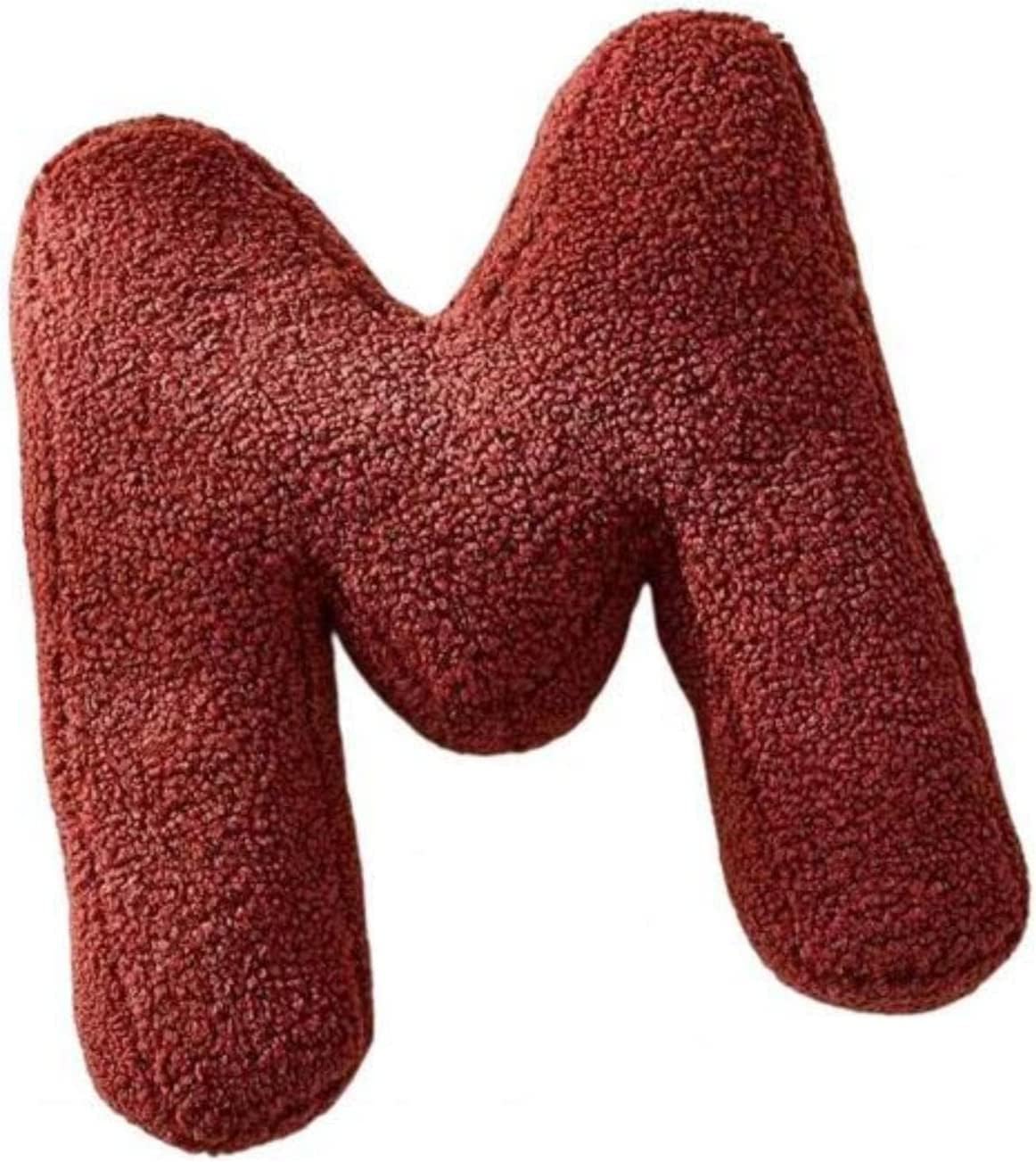 Red letter 'M' pillow on a white background