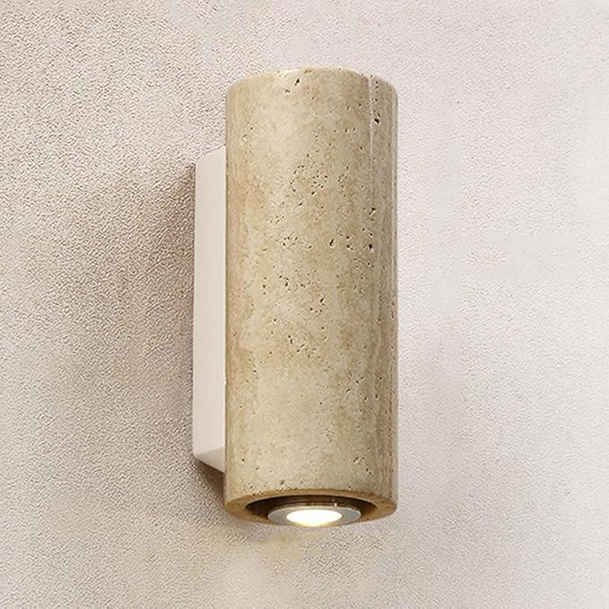 Cylindrical wall light fixture on a textured wall