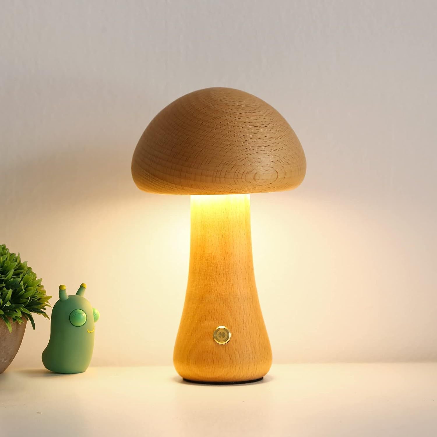 Wooden mushroom-shaped lamp emitting a warm glow on a neutral background