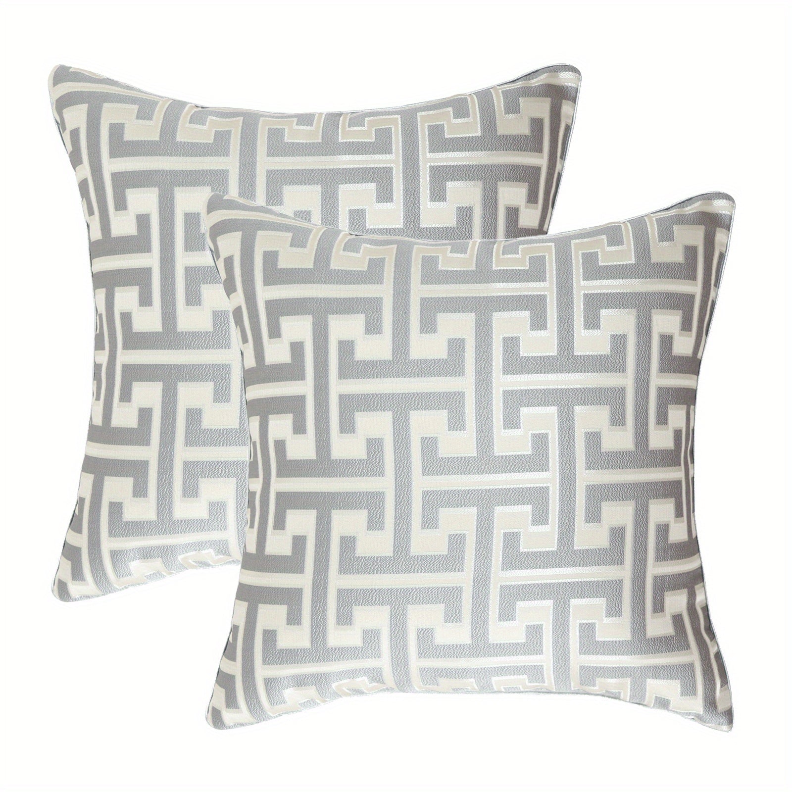 Two decorative pillows with geometric pattern on a white background