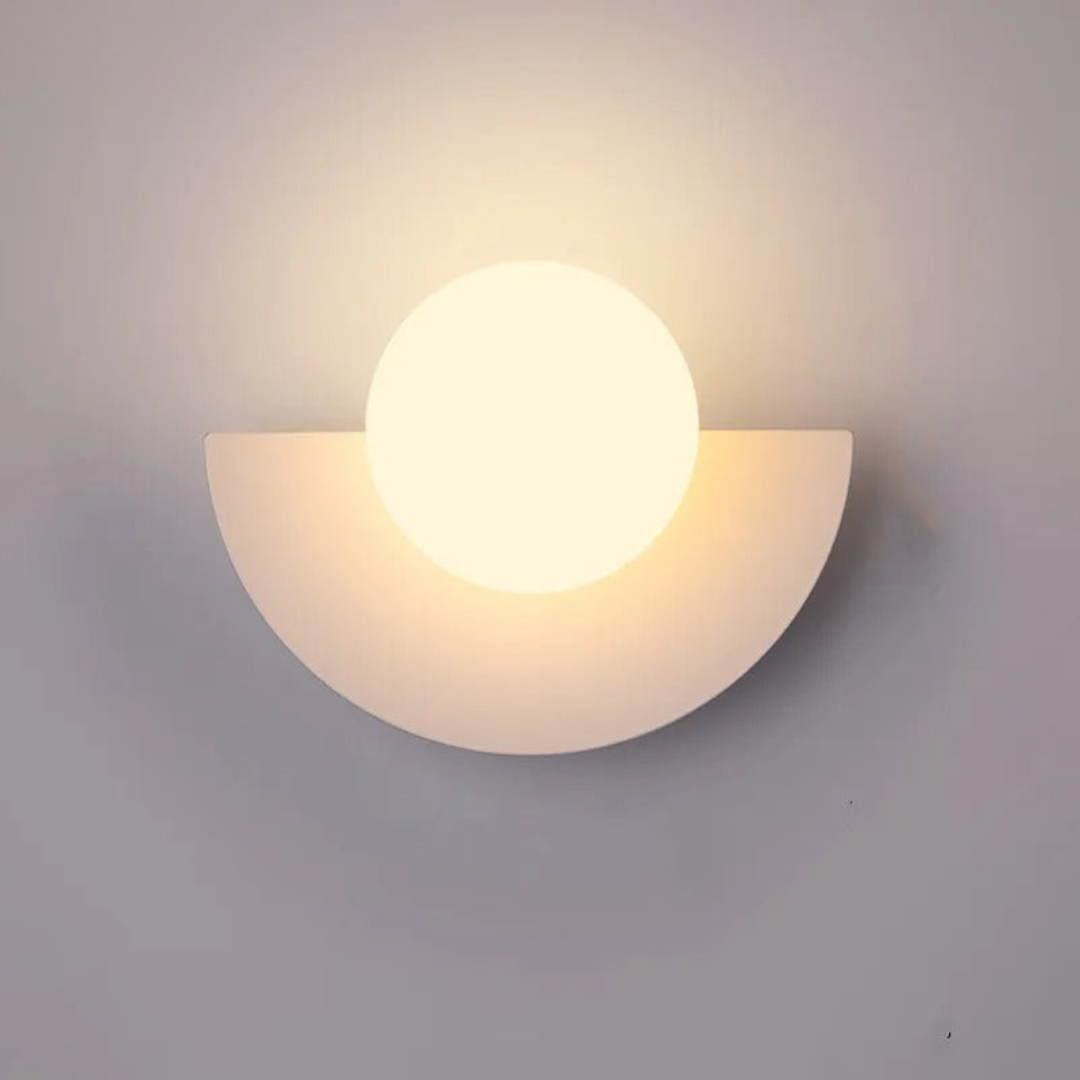 Wall-mounted light fixture with a half-circle design on a gray background