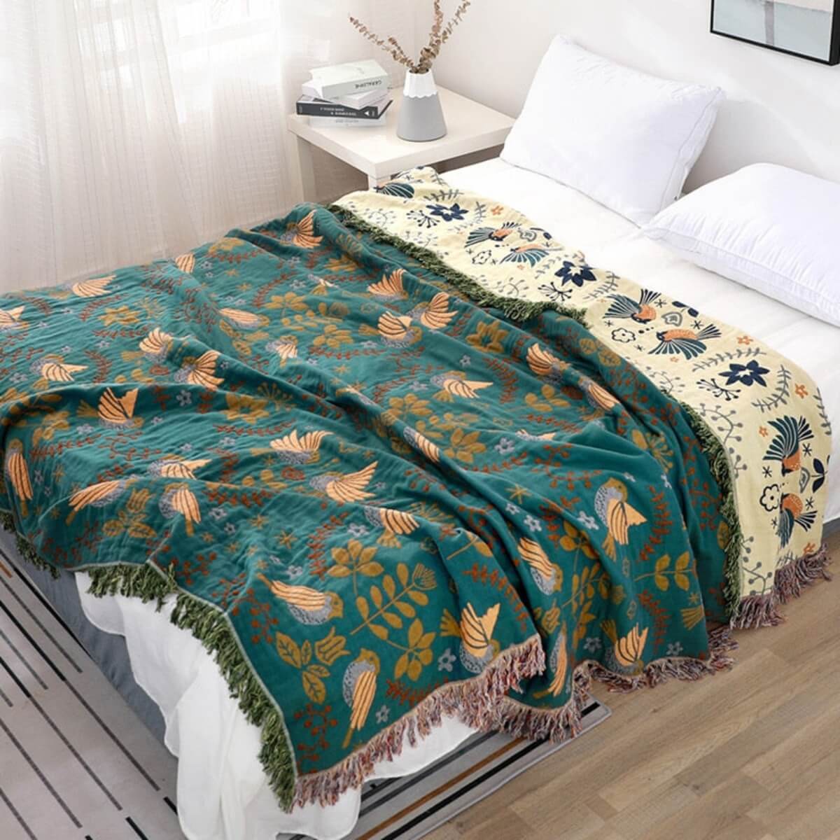 Decorative blanket with floral pattern on a bed in a bedroom setting