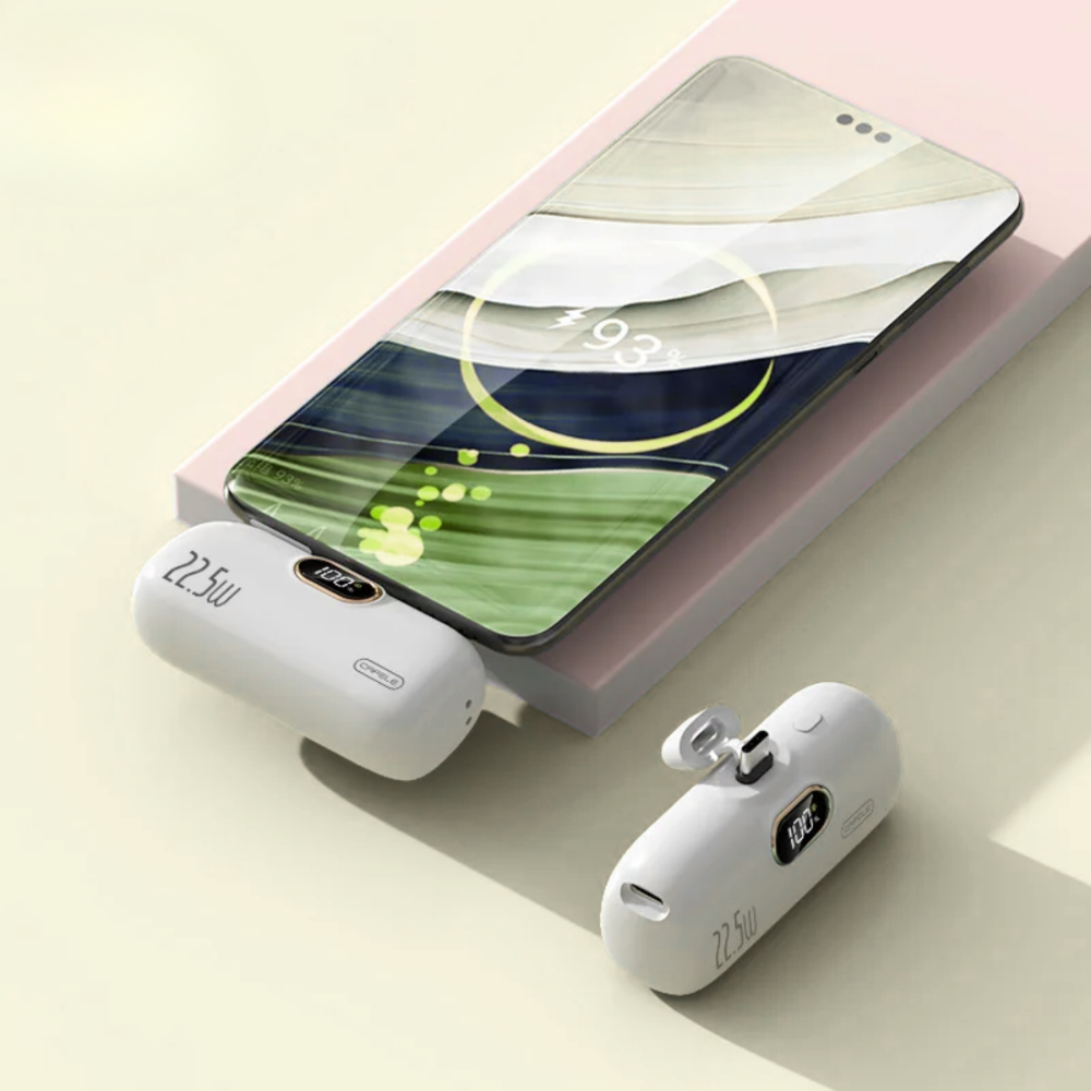 Smartphone with wireless earbuds and charging case on a light background