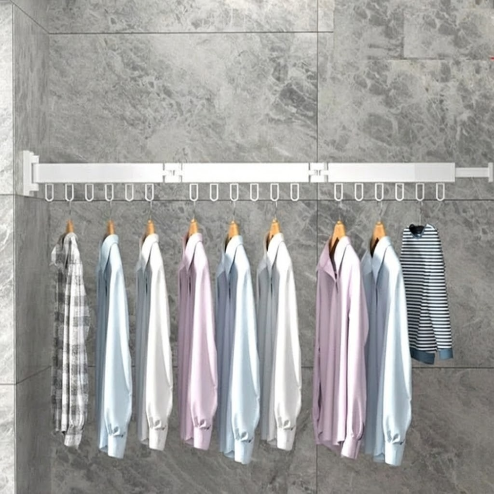Clothing rack with various shirts hanging on a tiled wall.