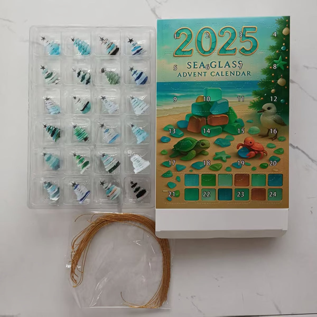 2025 Sea Glass Advent Calendar with sea glass ornaments and packaging on a white surface