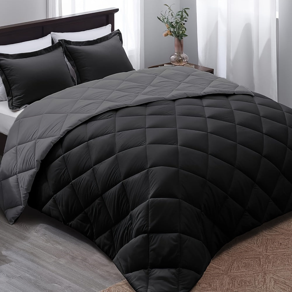 Black quilted comforter on a bed in a bedroom setting