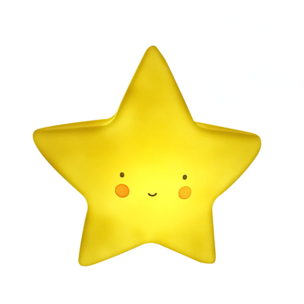 Yellow star-shaped pillow with a cute face on a white background