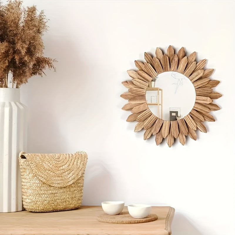 Decorative sunburst mirror with a woven basket and small bowls on a wooden surface.