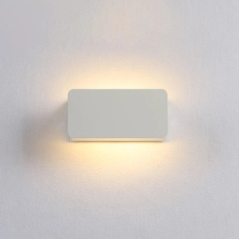 Rectangular wall light fixture on a white wall