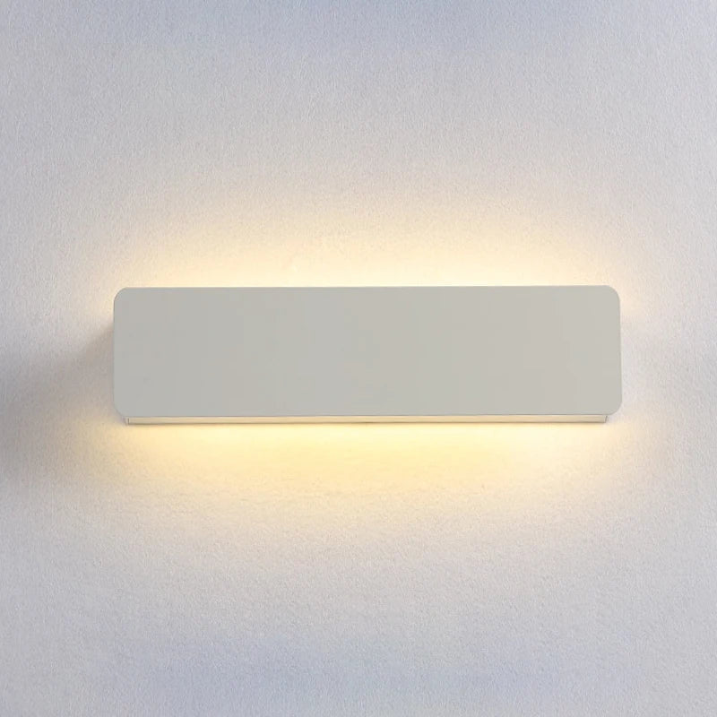 Rectangular wall light fixture on a plain wall