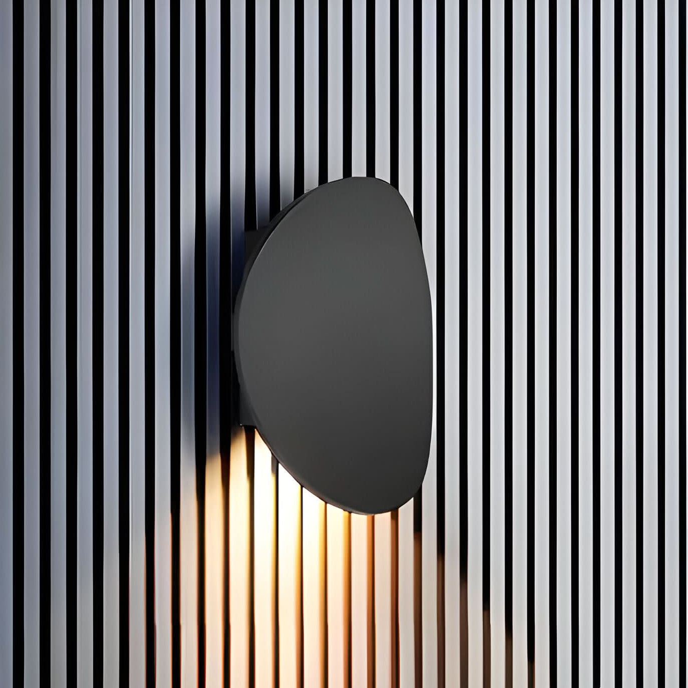 Modern wall light fixture on a striped background