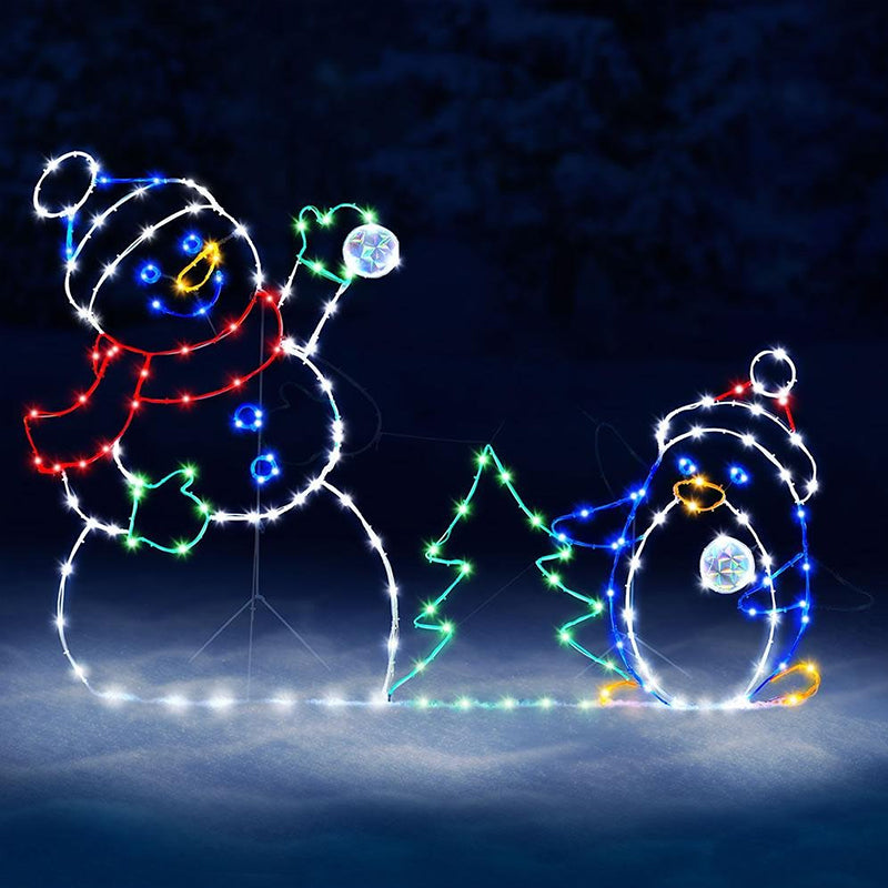 Decorative lights shaped like a snowman and penguin on a dark background