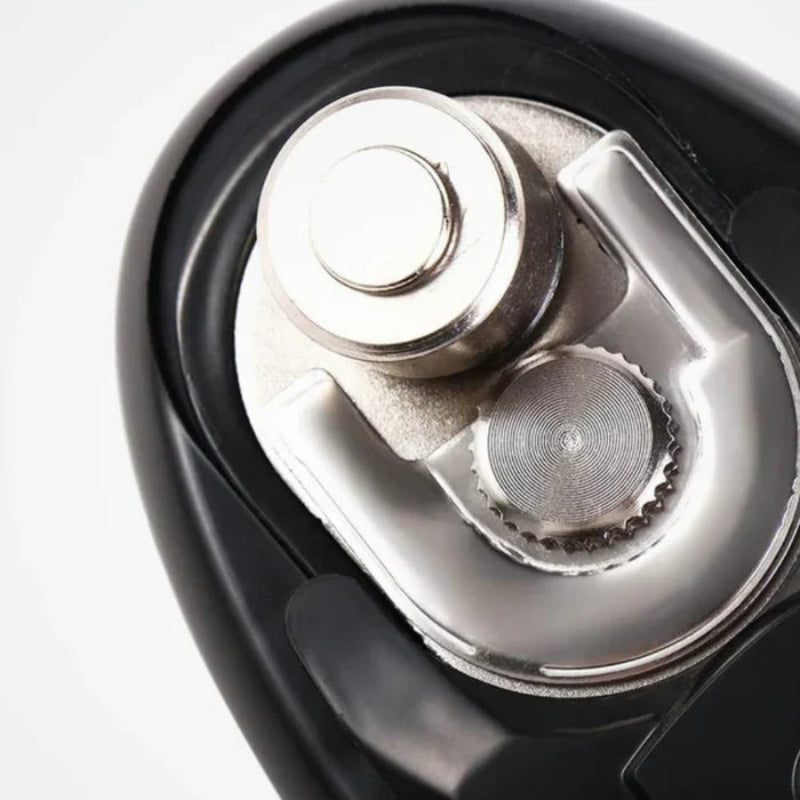 Close-up of a black and silver electric shaver on a white background