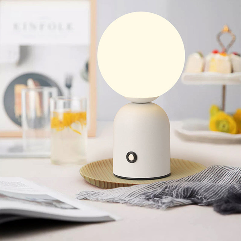 White lamp on a table with a blurred background