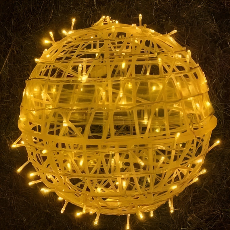 Decorative spherical light made of wicker with string lights on a dark background