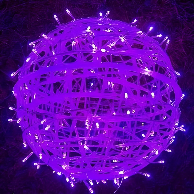 Purple decorative light ball with string lights on a dark background