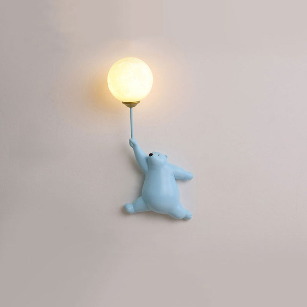 Light blue bear-shaped night light on a plain wall