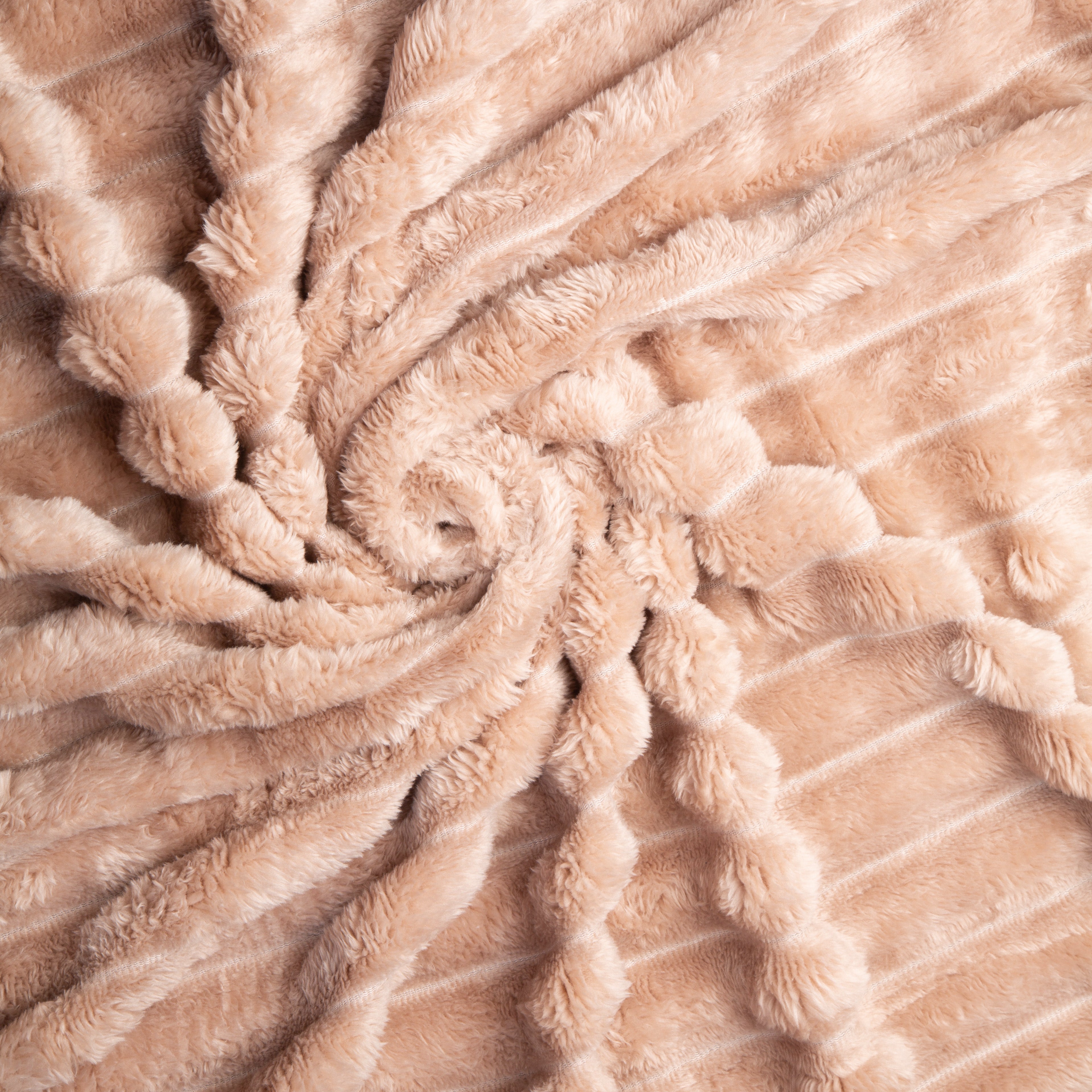 Close-up of beige textured fabric with a spiral pattern