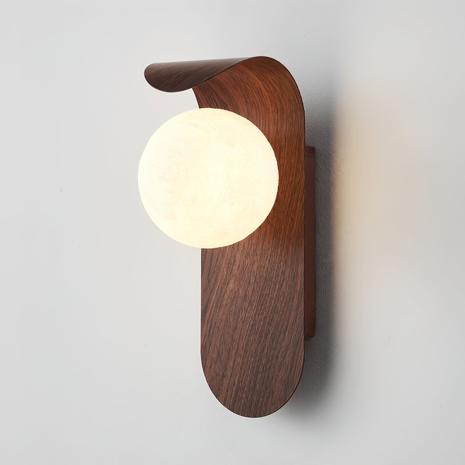 Wooden wall sconce with a round light bulb on a plain background