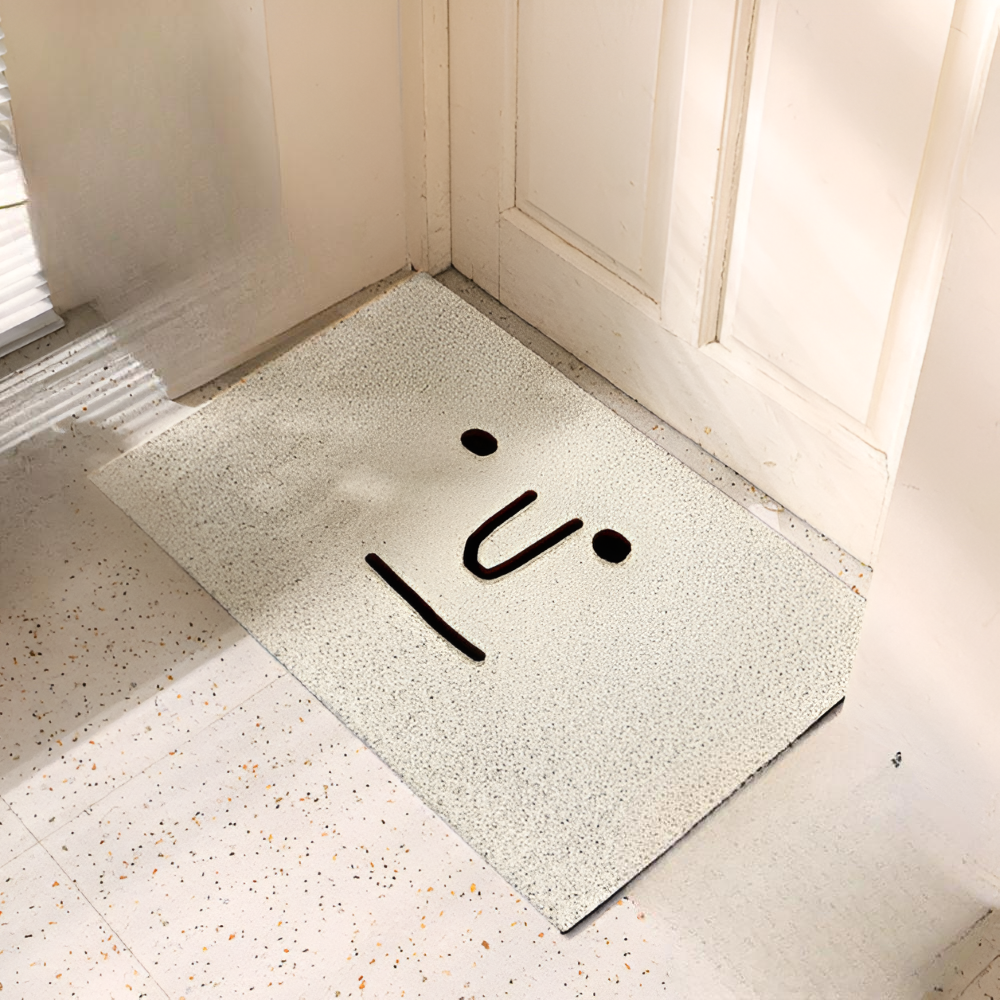 Doormat with a unique design on a light-colored floor.