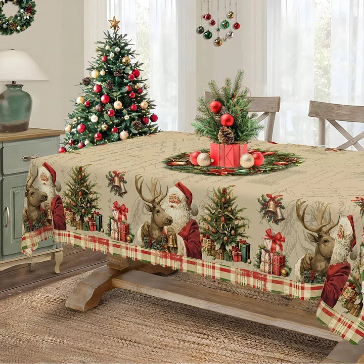 Christmas-themed tablecloth with Santa Claus, reindeer, and trees on a dining table.