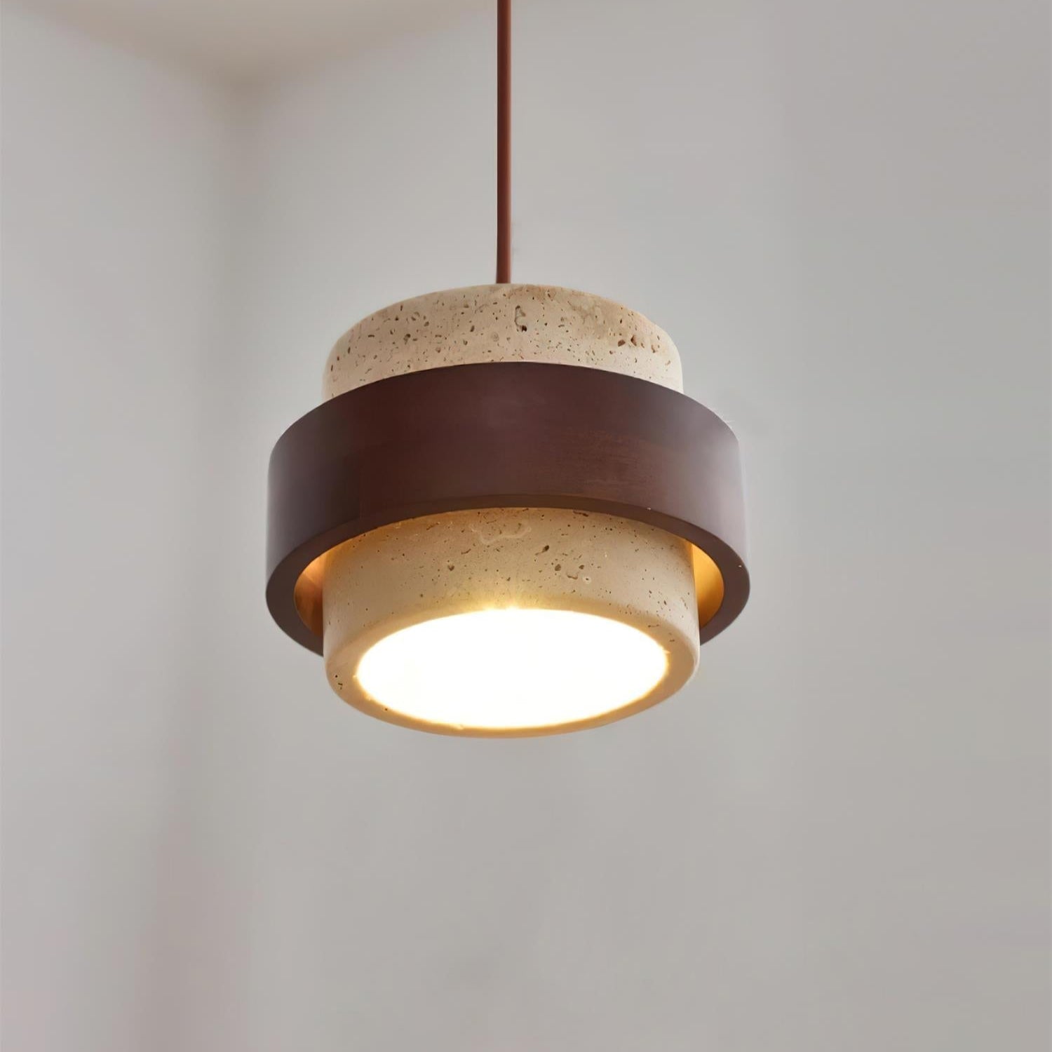 Pendant light with brown and beige design on a neutral background