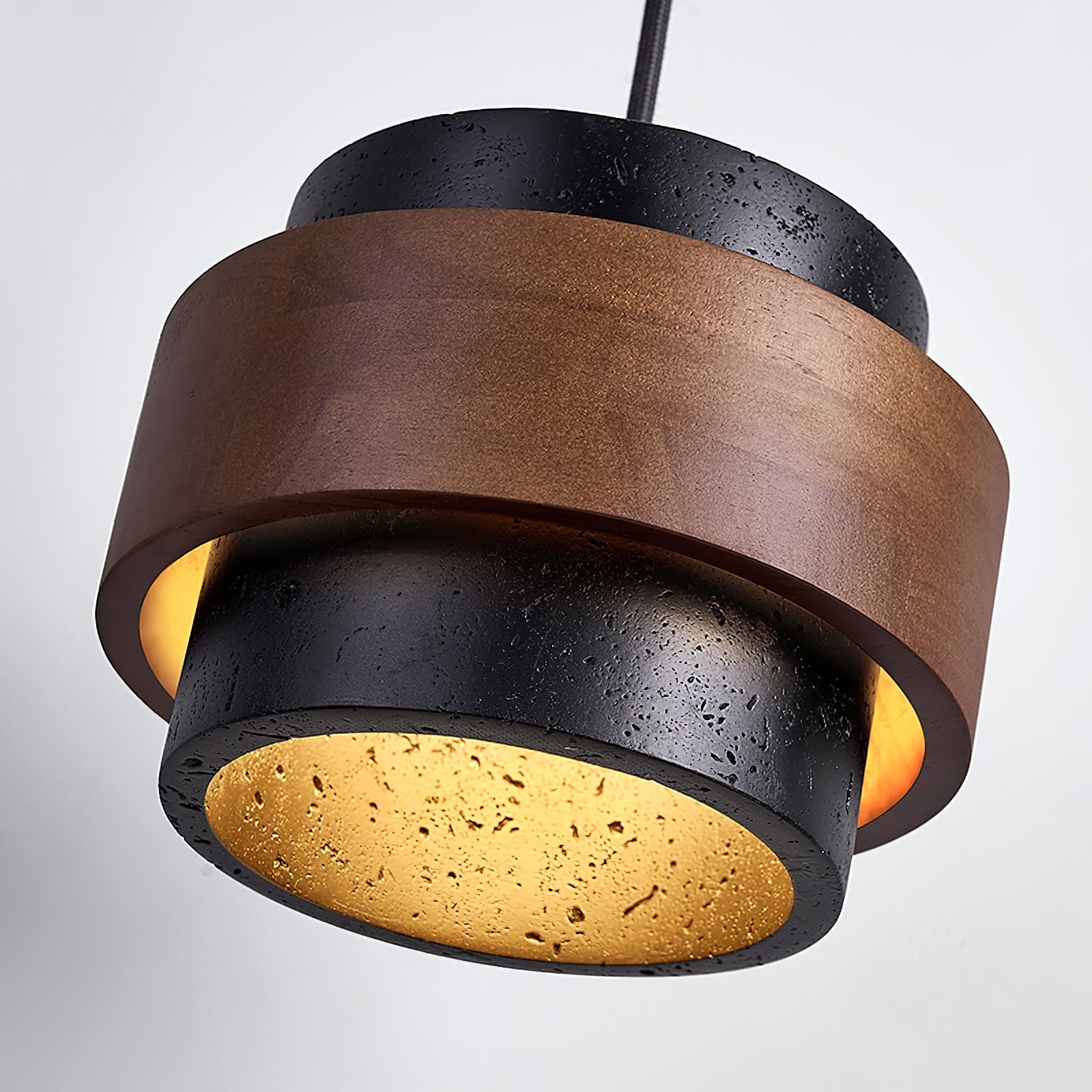 Modern pendant light with brown and black design on a gray background