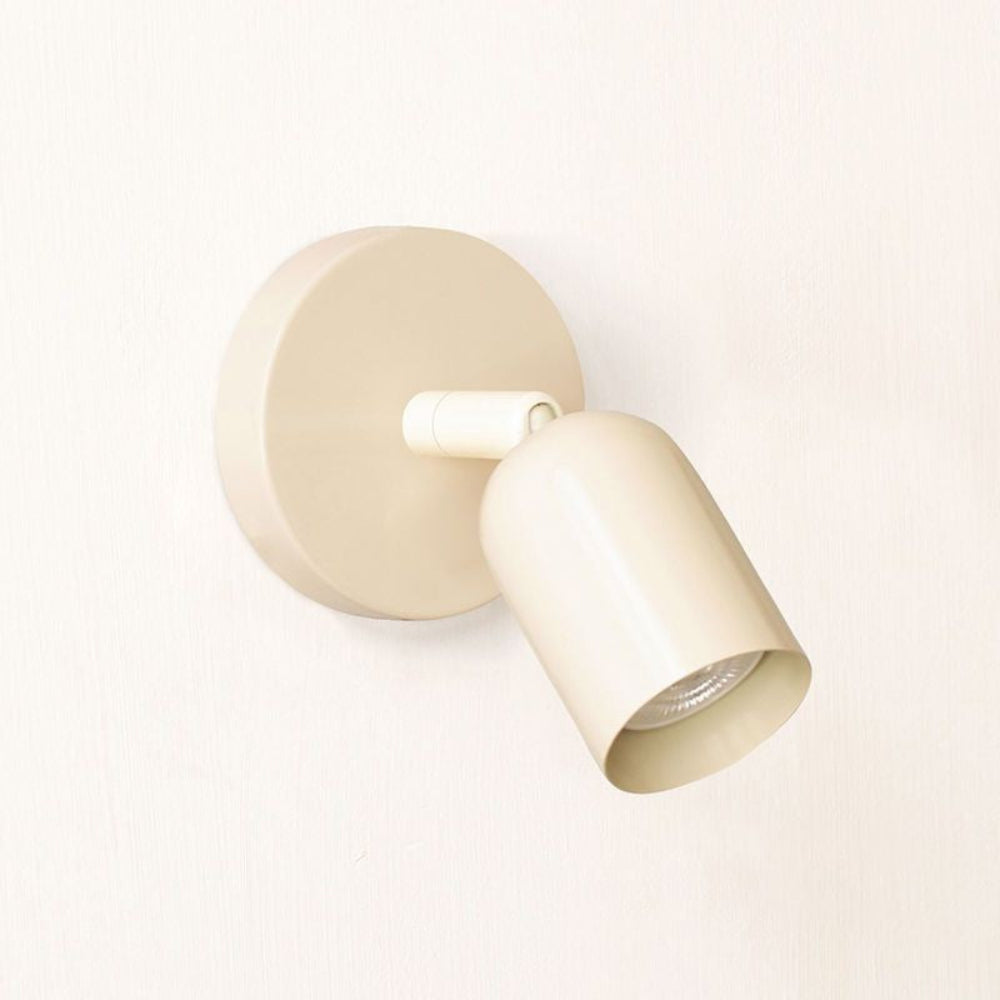 Beige wall light fixture on a white background