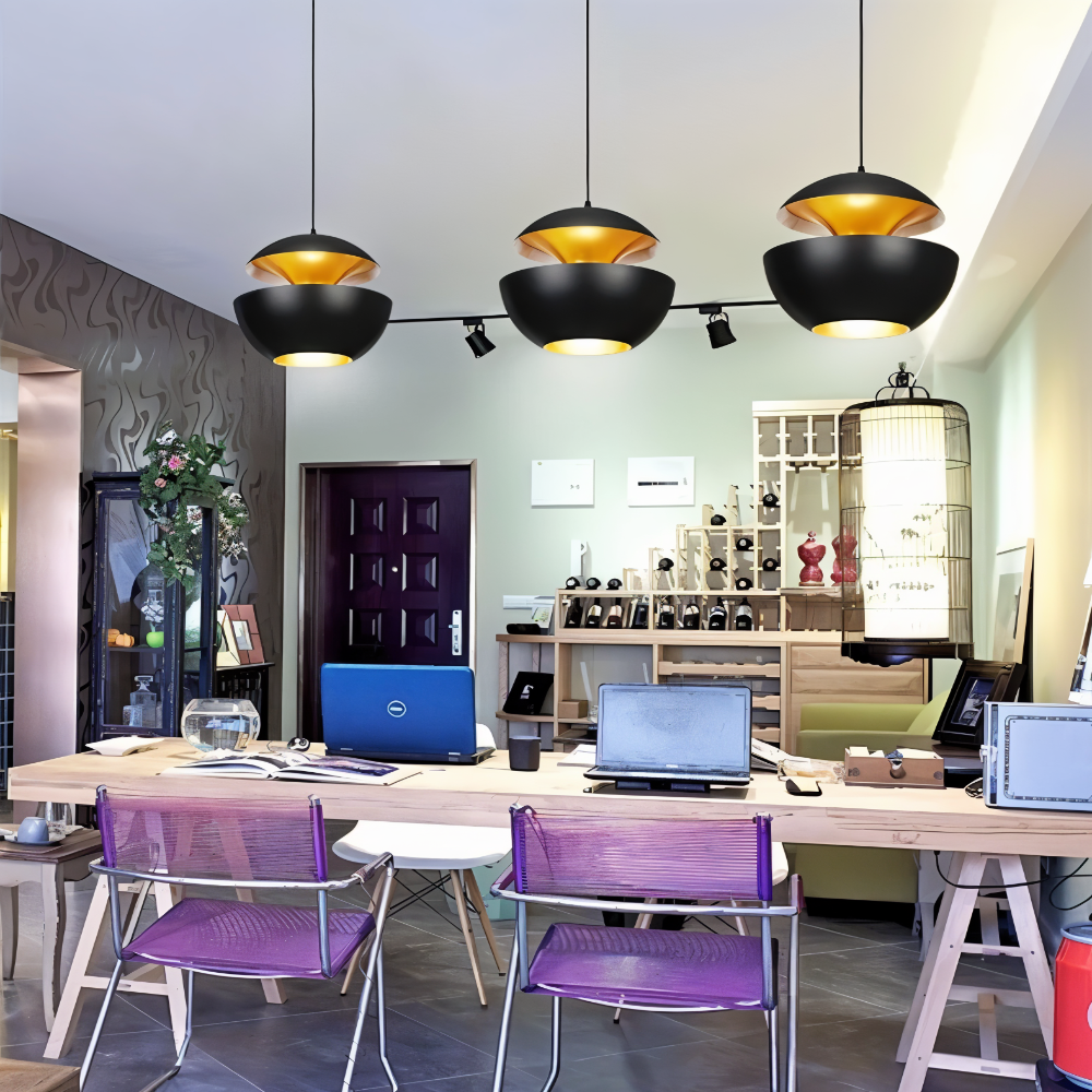 Modern office space with desks, chairs, and decorative elements.