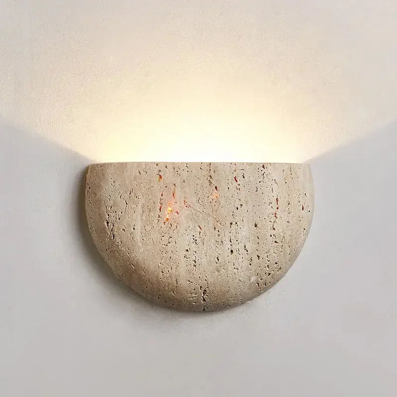 Cement wall sconce on a white wall