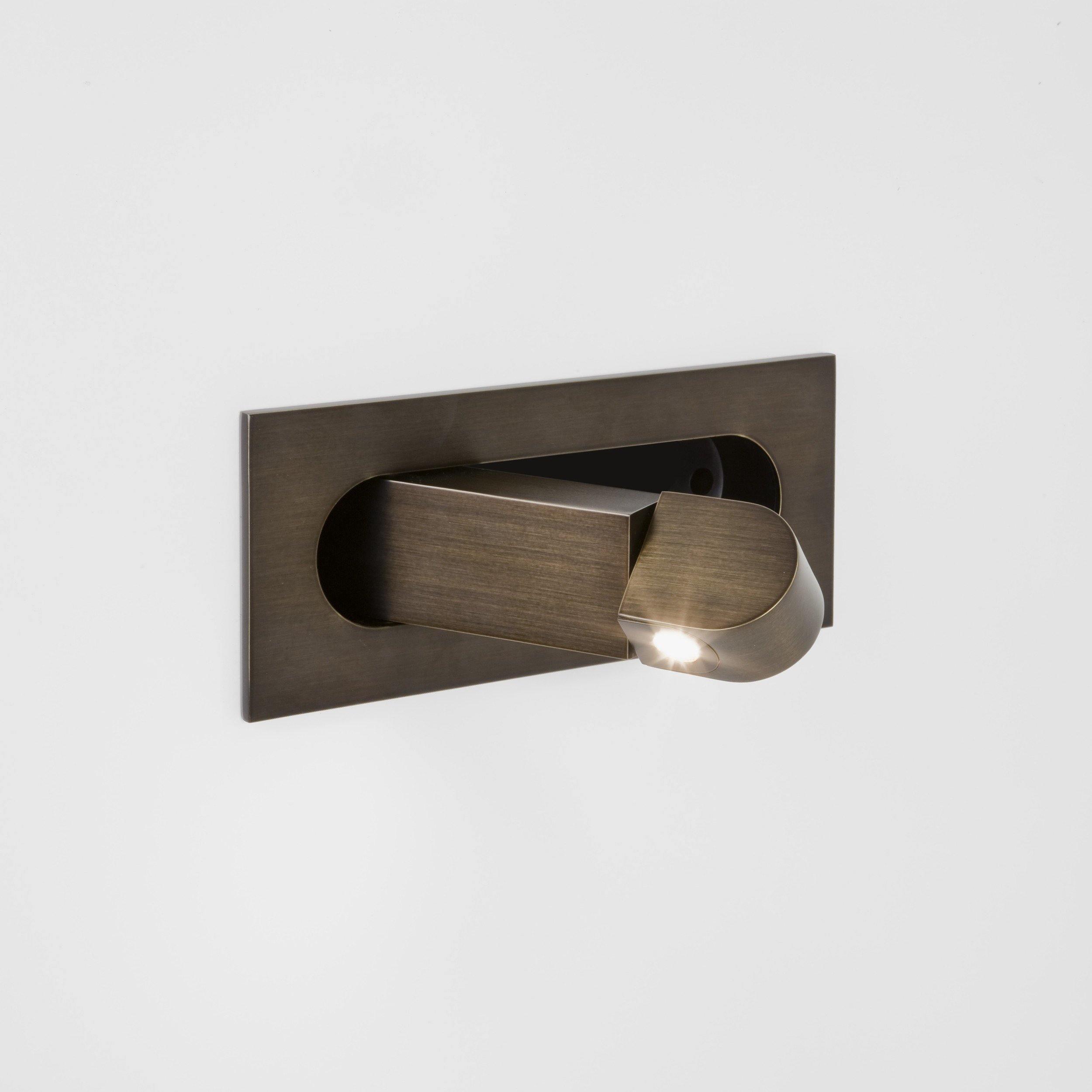 Bronze wall-mounted shower control valve on a white background