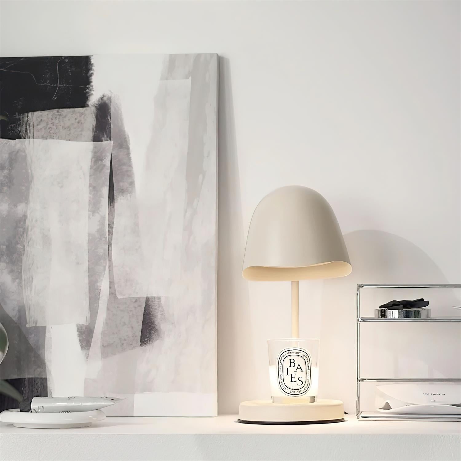 Small lamp on a surface with abstract art in the background