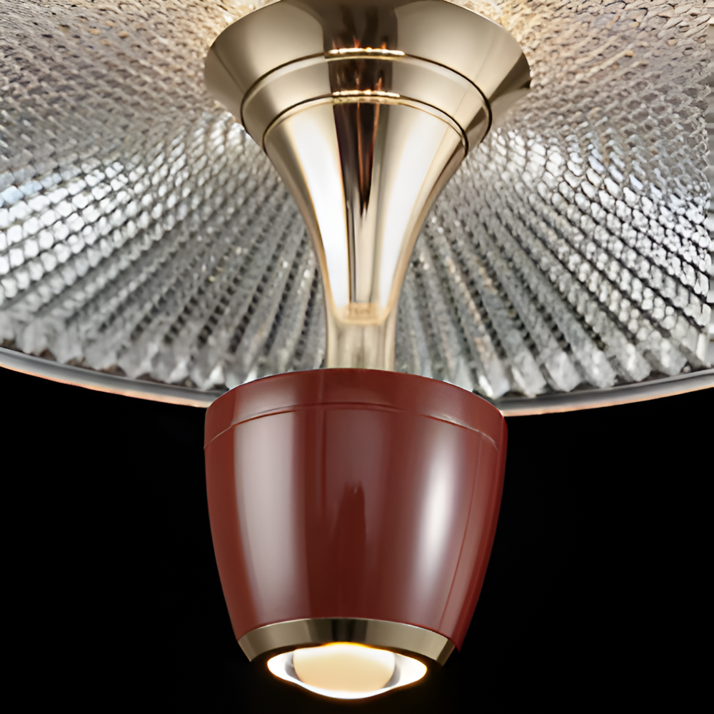 Close-up of a ceiling light fixture with a metallic finish.