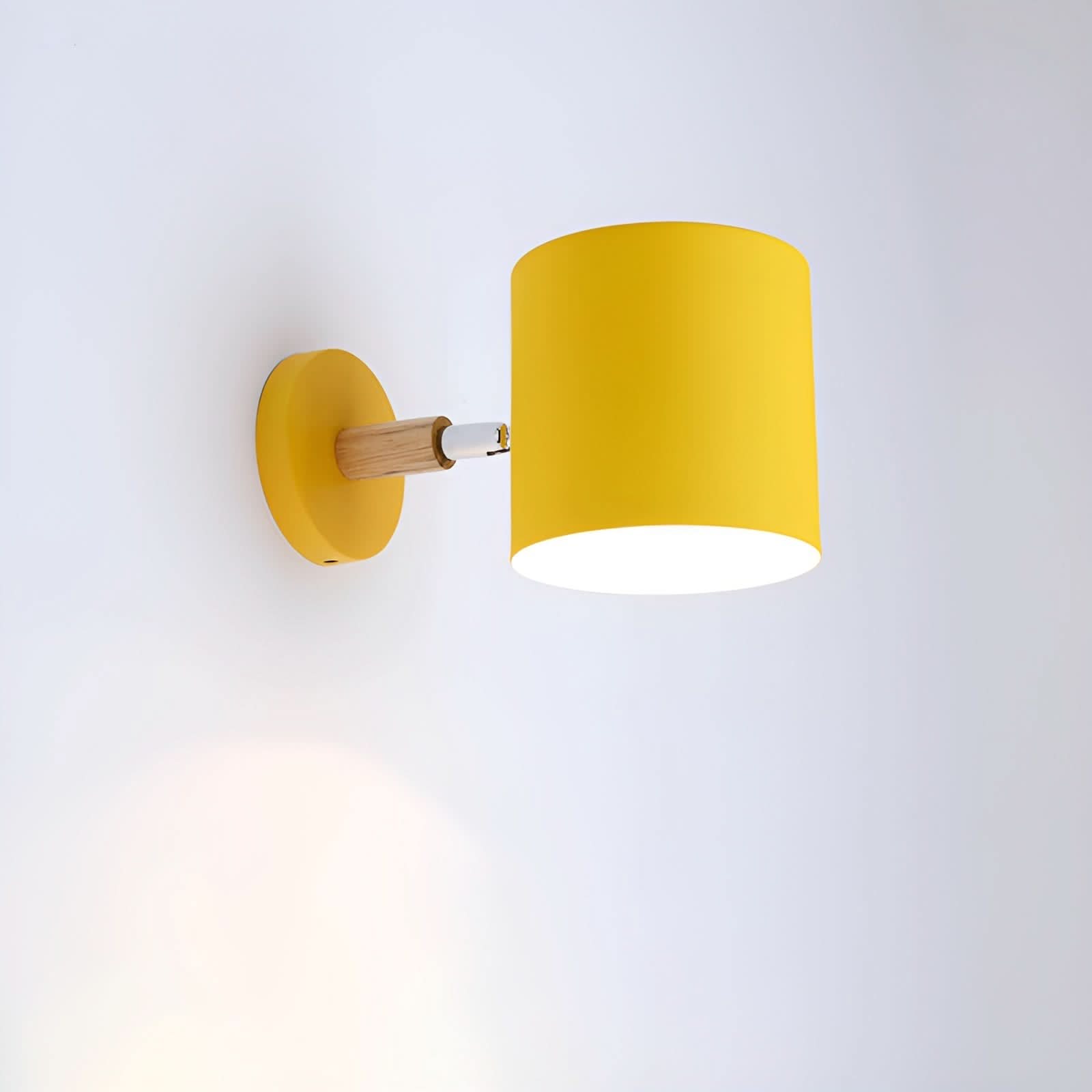 Yellow wall lamp with wooden fixture on a white background
