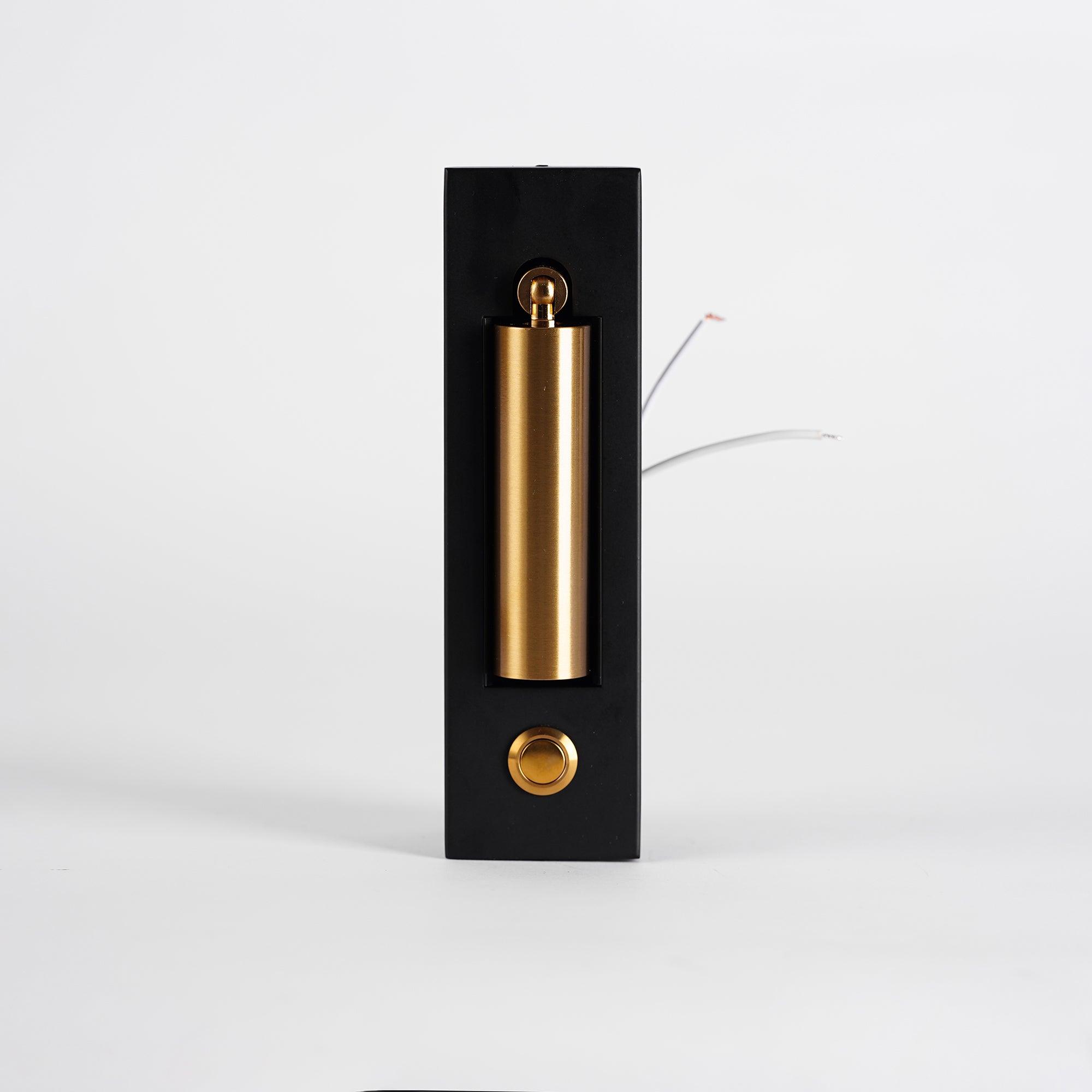 Gold cylindrical object with black base on a white background