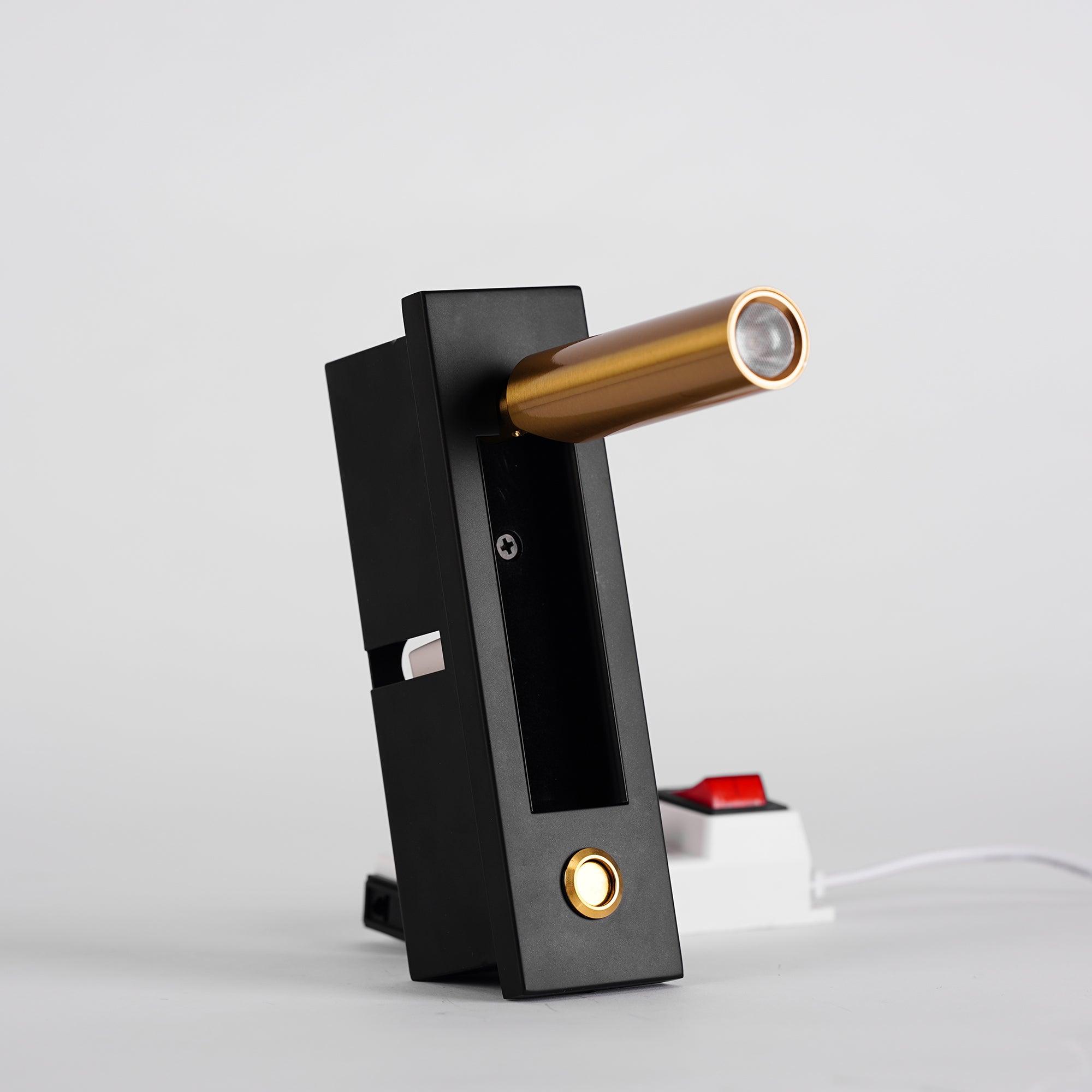 Modern door handle with black finish and gold accents on a white background