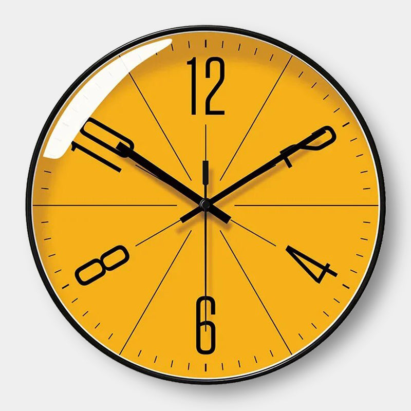 Yellow wall clock with black numbers and hands on a white background