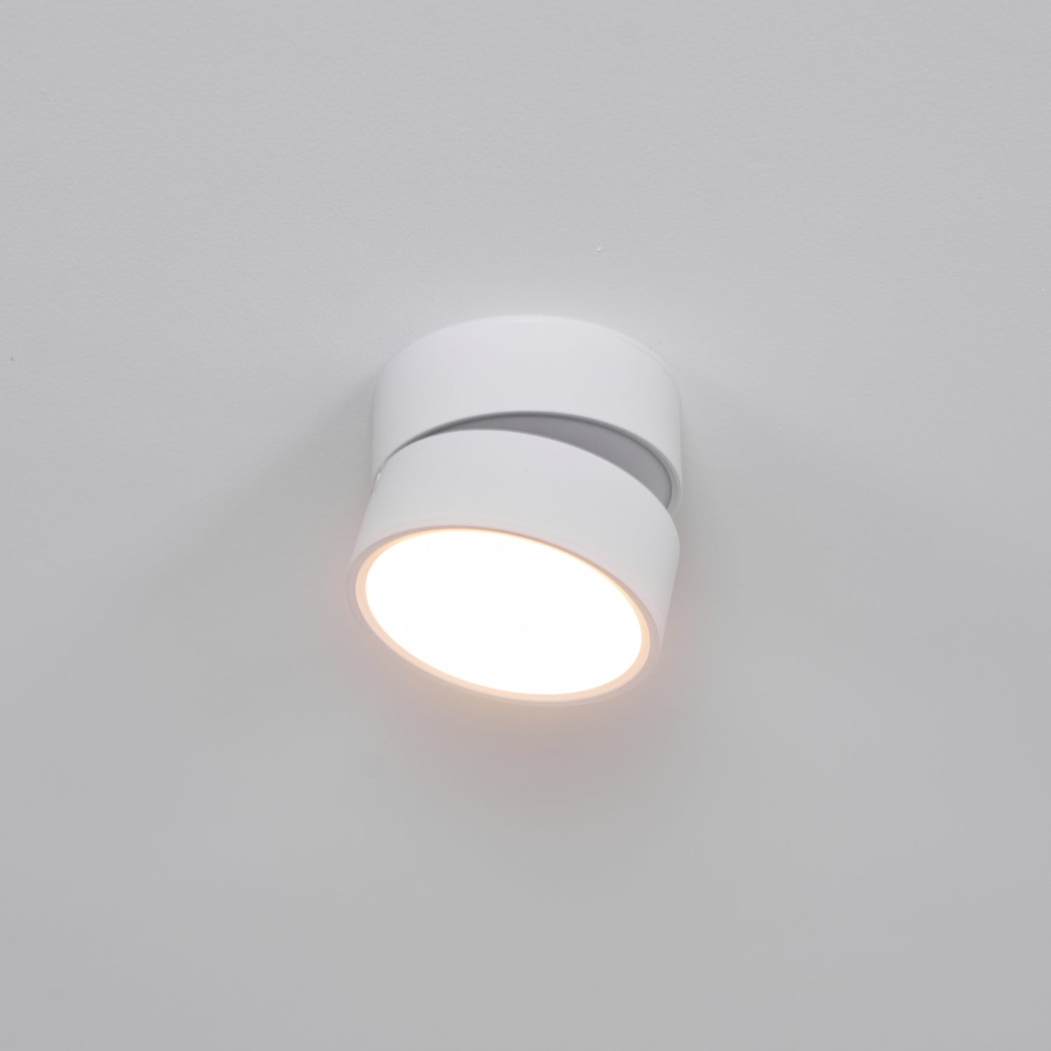 White ceiling light fixture on a gray background